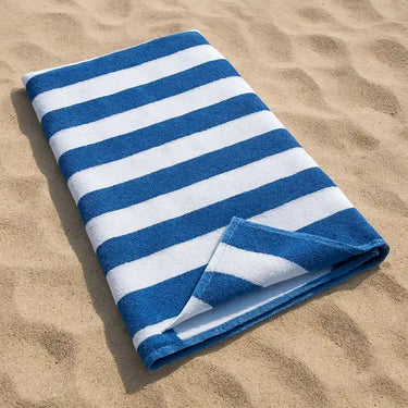 Large blue and white striped cotton beach towel made from premium 100% cotton, offering a soft, absorbent and oversized design for the beach, pool, holidays and outdoor living in Australia.