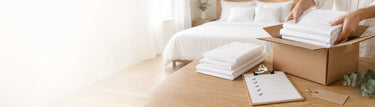 White bed sheets being packed in a box for Linen King Australia returns and refunds.
