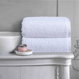 White 100% cotton bath towels with a plush, hotel-quality finish, offering excellent absorbency and softness for family bathrooms, hotels and Australian homes.
