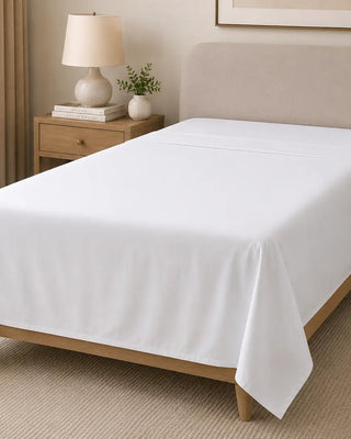 Grande Hotel white flat sheet on a modern bed, made from a soft cotton blend for comfortable sleep, hotel-style bedding and everyday use in Australian homes and guest accommodation.