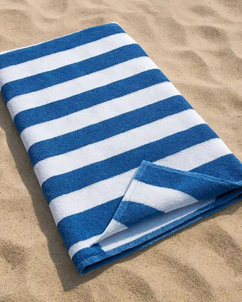 Large blue and white striped cotton beach towel made from premium 100% cotton, offering a soft, absorbent and oversized design for the beach, pool, holidays and outdoor living in Australia.